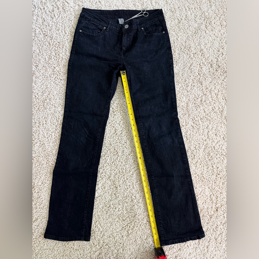 Women’s size 8 black boot cut jeans.